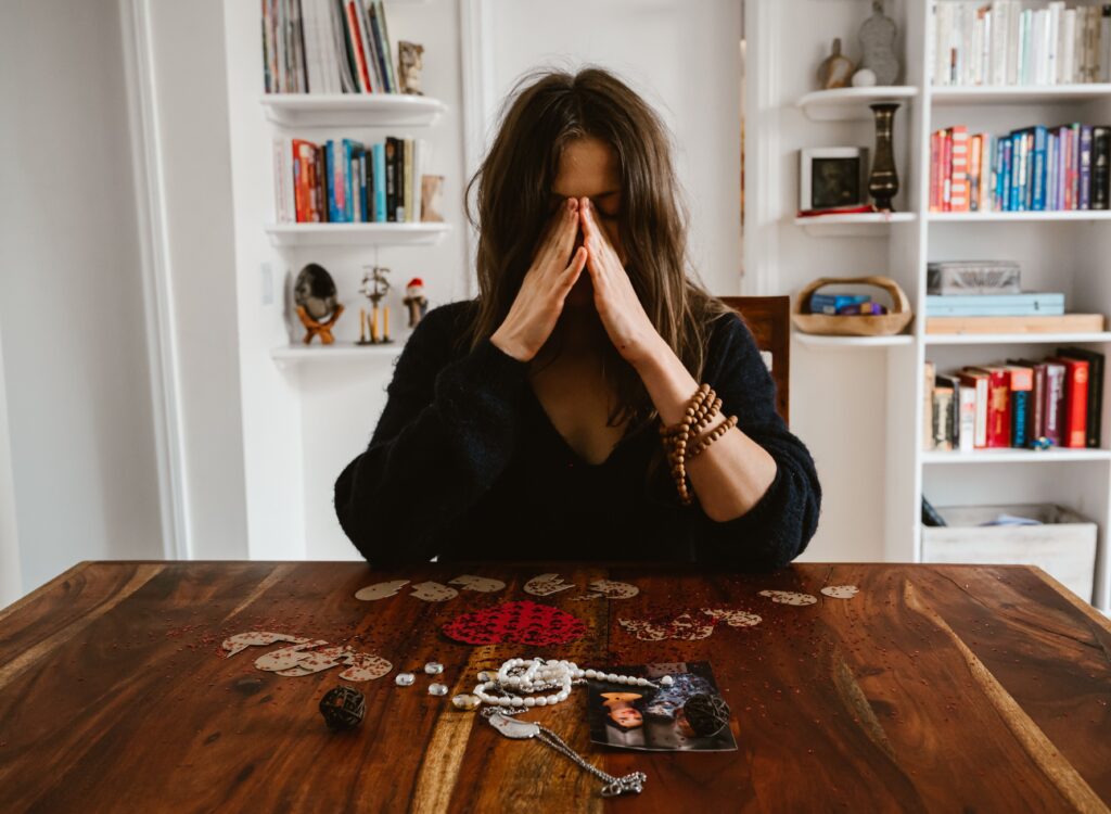 stressed woman sitting at a table
